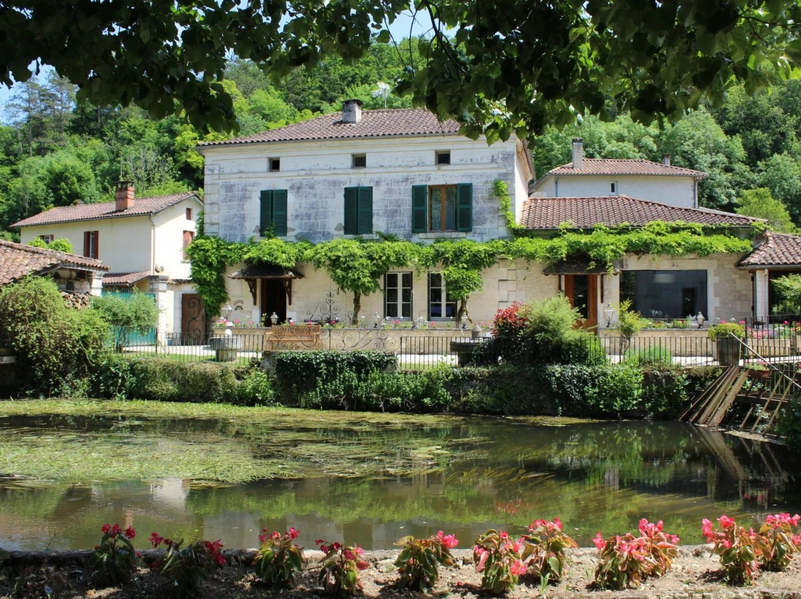 A restored 16th-century watermill on the River Dronne in the Dordogne